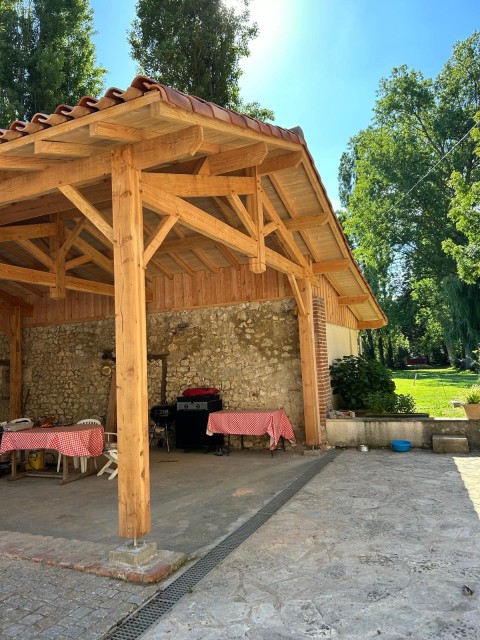 Extension bois en charpente traditionnelle à Pujols